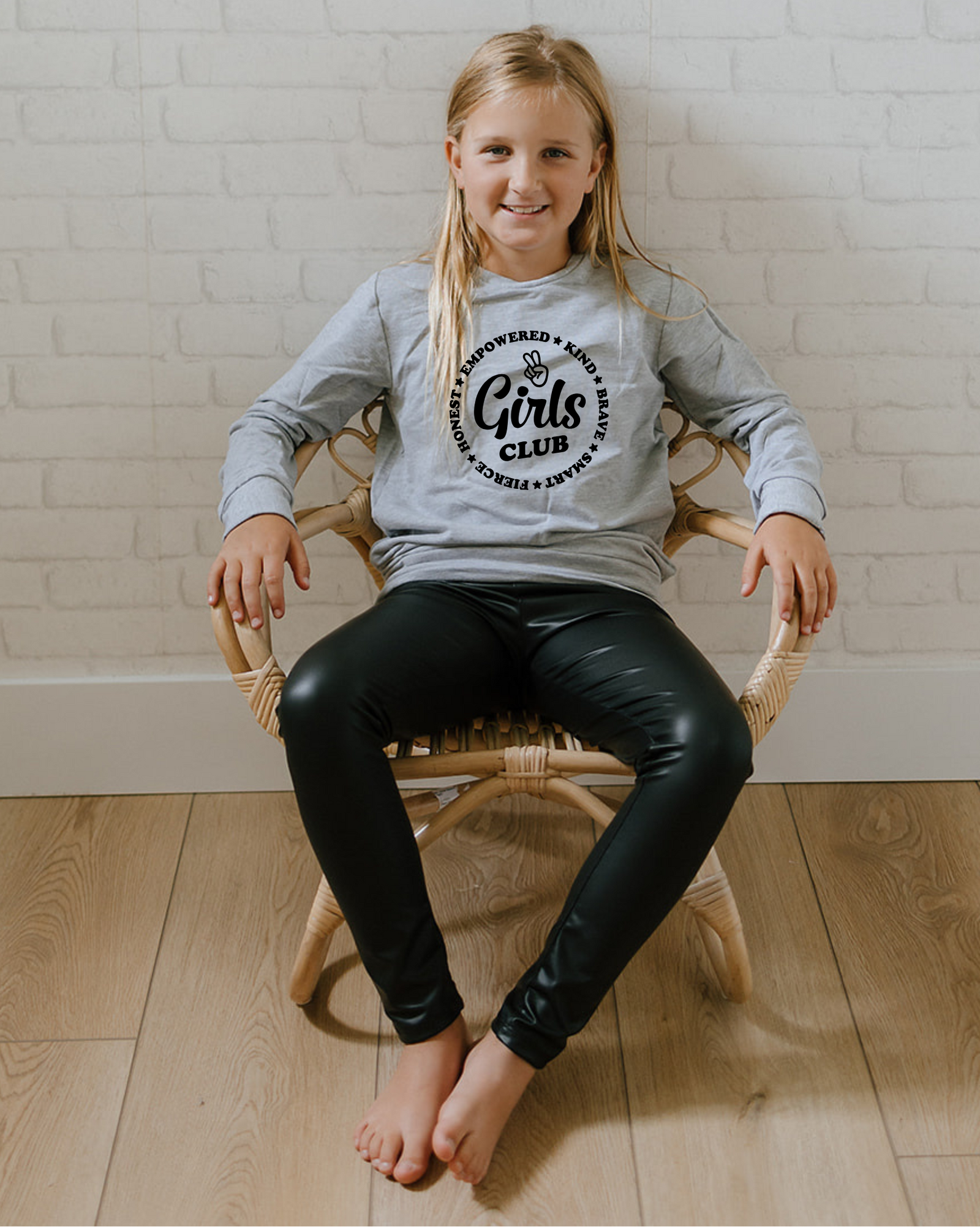 Girls Club image with a black flowy sweater-fabric skirt