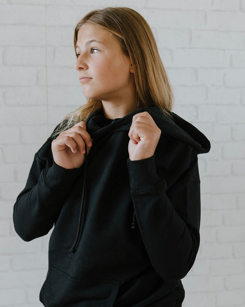 Girl wearing a rich burgundy hoodie