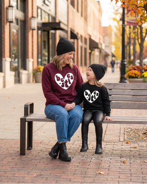 Mom and daughter laughing together on a bench