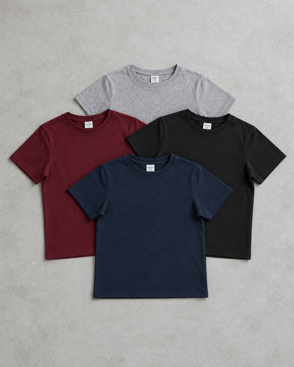 Baby on a burgundy blanket wearing a naturally draped NEW TO THE TEAM tee