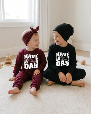Toddler and older boy with matching-size white Have a Good Day decals