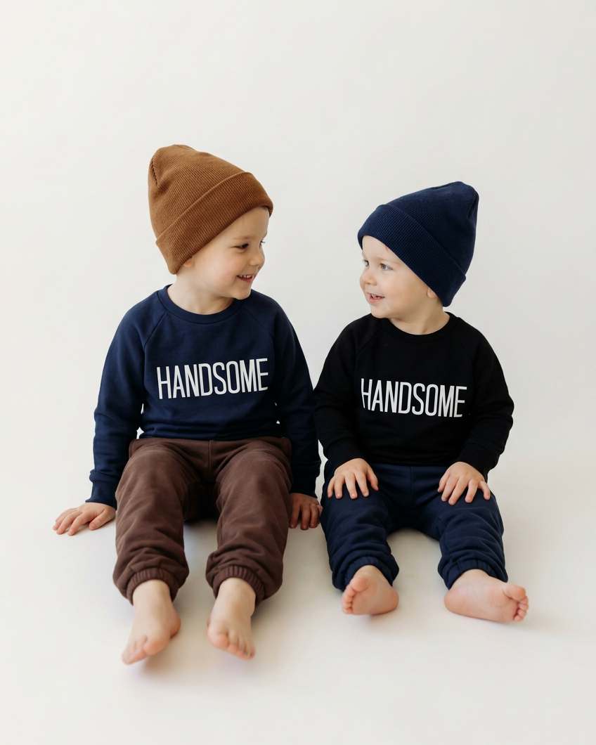 Two little boys in HANDSOME sweaters, beanies, and relaxed sweatpants