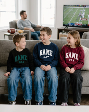 Youth kids hanging out on the couch for family football day